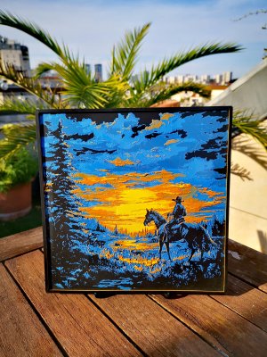 Gravure cowboy au coucher du soleil